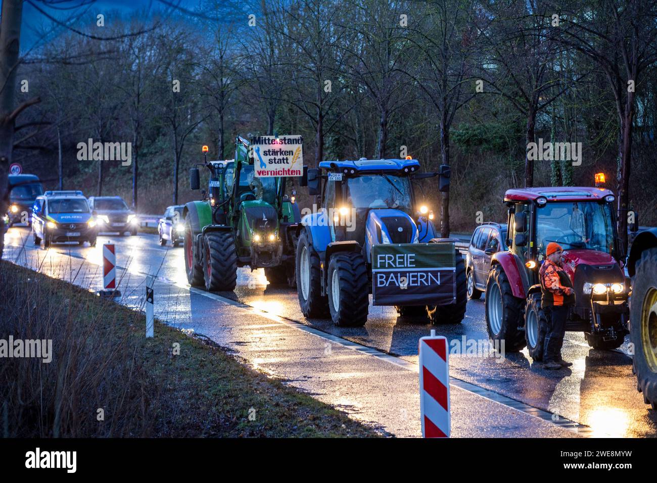 Kassel, Germany, January 24, 2024, Farmers are blocking the B3 from the A49 towards Kassel with their tractors and vehicles. At four locations on the B3, B7 and B83, the farmers blocked traffic, which could only pass the protesting farmers in one lane. The feared traffic chaos did not materialise. The protest was organised by the loose farmers' network 'Land schafft Verbindung' (LSV). The Hessian Farmers' Association dissociated itself from LSV's blockade plans in order not to lose the support of the population for the protests. The action will be repeated on 25 and 26 January from five to nin Stock Photo