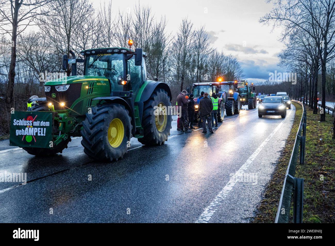 Kassel, Germany, January 24, 2024, Farmers are blocking the B3 from the A49 towards Kassel with their tractors and vehicles. At four locations on the B3, B7 and B83, the farmers blocked traffic, which could only pass the protesting farmers in one lane. The feared traffic chaos did not materialise. The protest was organised by the loose farmers' network 'Land schafft Verbindung' (LSV). The Hessian Farmers' Association dissociated itself from LSV's blockade plans in order not to lose the support of the population for the protests. The action will be repeated on 25 and 26 January from five to nin Stock Photo