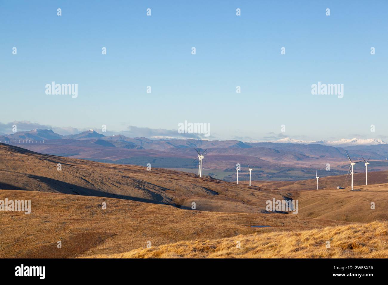 Looking North from the summit of Ben Cleuch towards a windfarm on Burnfoot Hill in the Ochil Hills Stock Photo