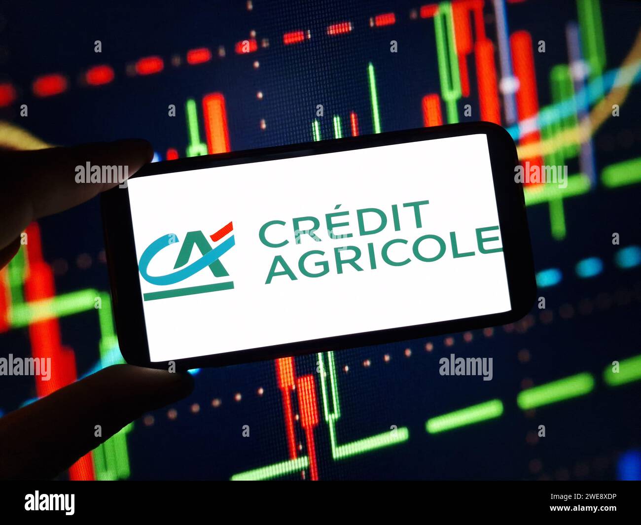 Konskie, Poland - January 23, 2024: Credit Agricole company logo displayed on mobile phone screen Stock Photo