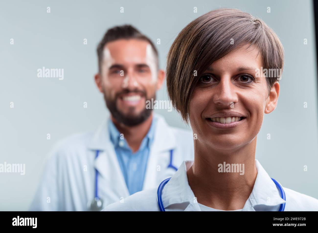 focus on the female doctor's friendly demeanor indicates her prominent ...