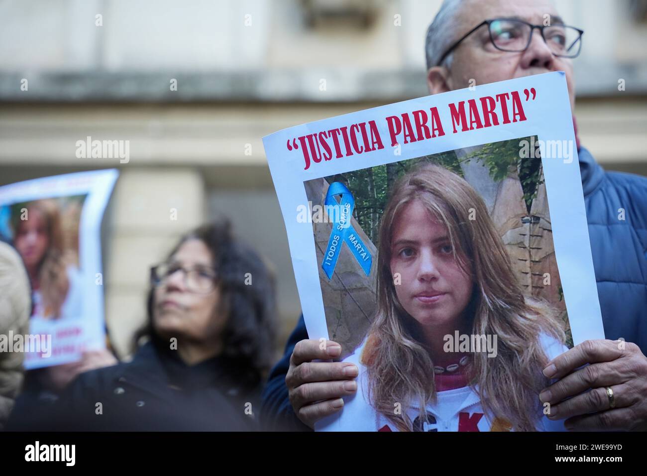 Demonstrators with posters with the photo of Marta del Castillo, during the rally in front of