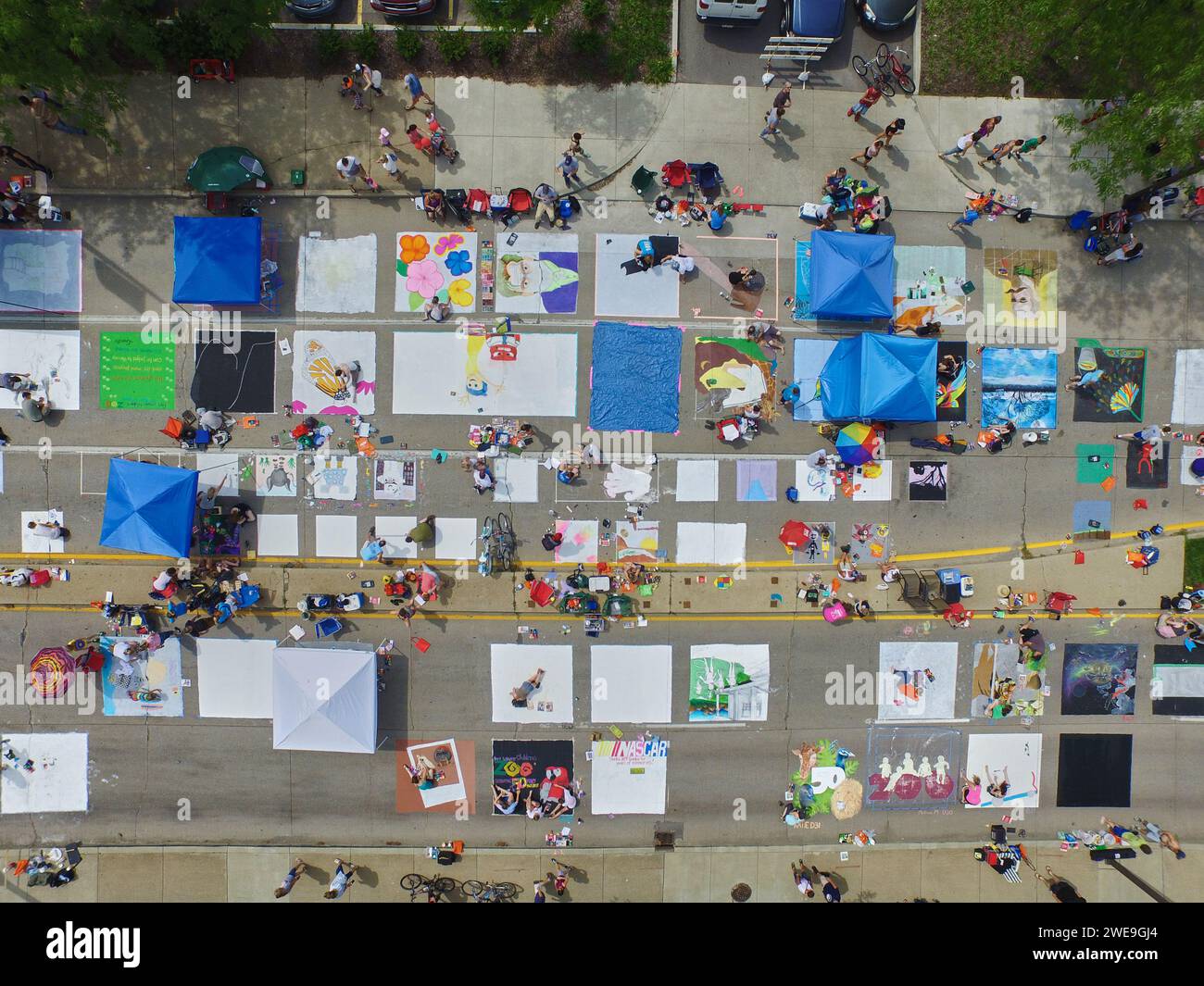 Aerial View of Bustling Street Fair with Sidewalk Art in Downtown Fort