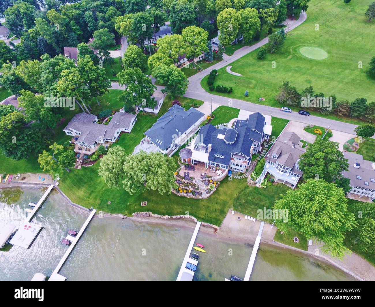 Aerial View of Affluent Lakeside Homes with Golf Course Stock Photo