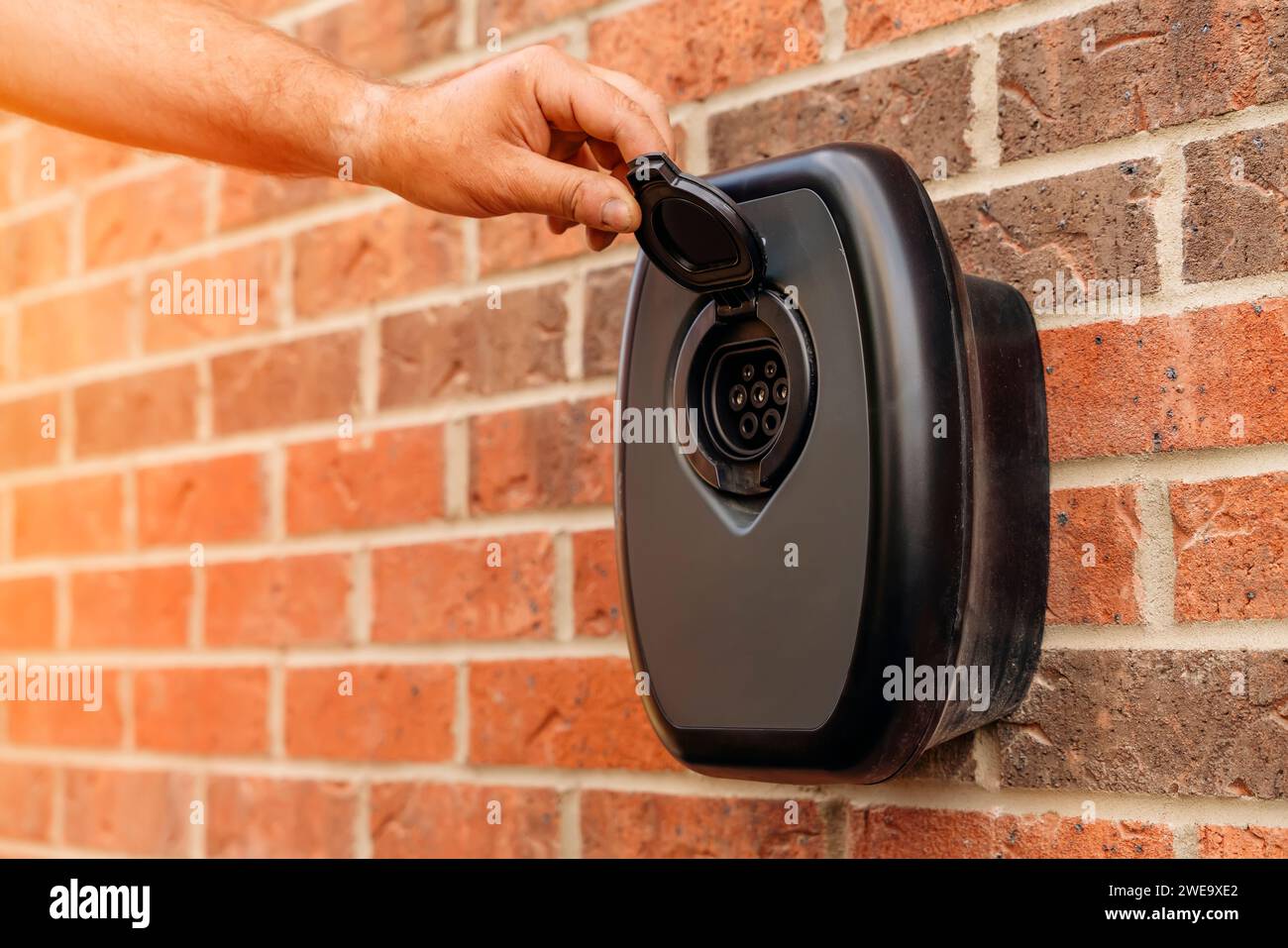 Electric vehicle domestic charging point installed outside of the house