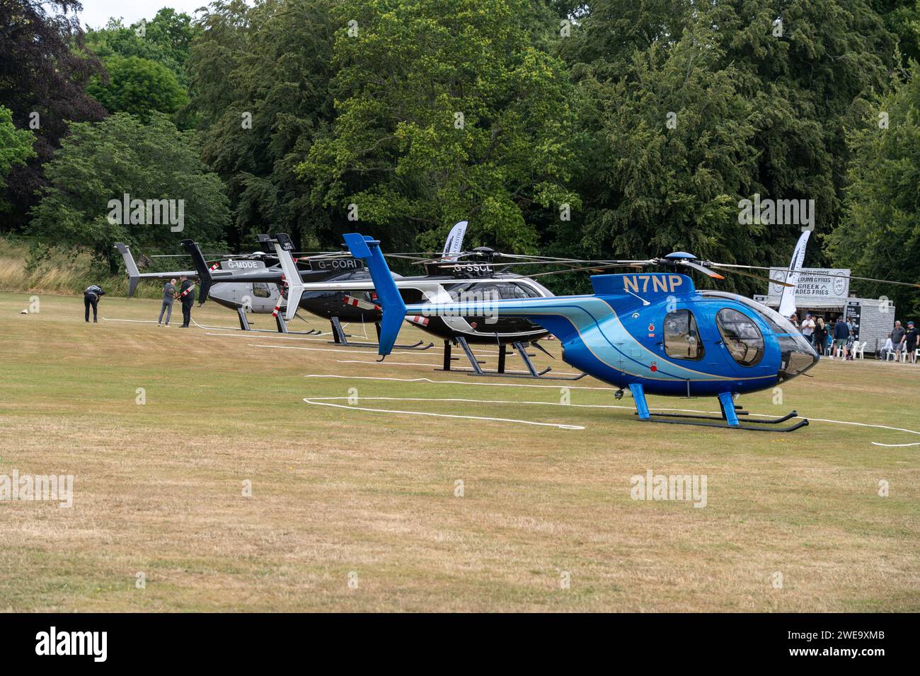 4 Helicopters Parked in a Row Stock Photo