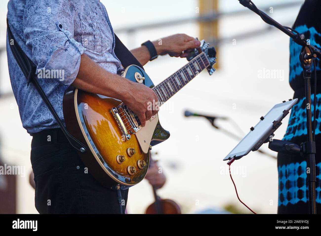 Outdoor Electric Guitar Performance in Casual Wear Stock Photo