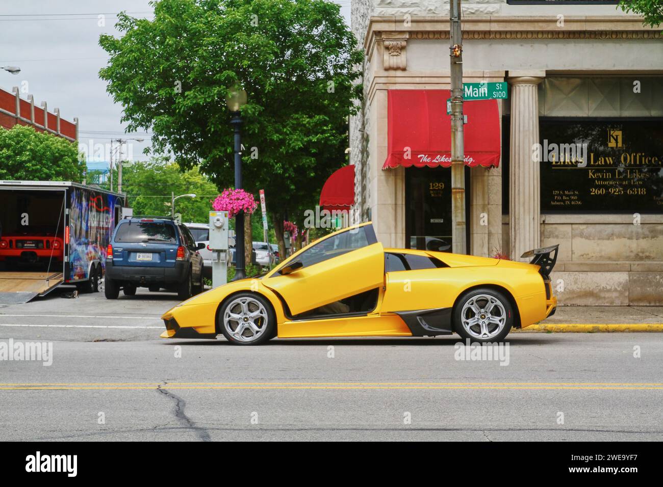 Yellow Sports Car with Gullwing Doors on City Street Stock Photo Alamy