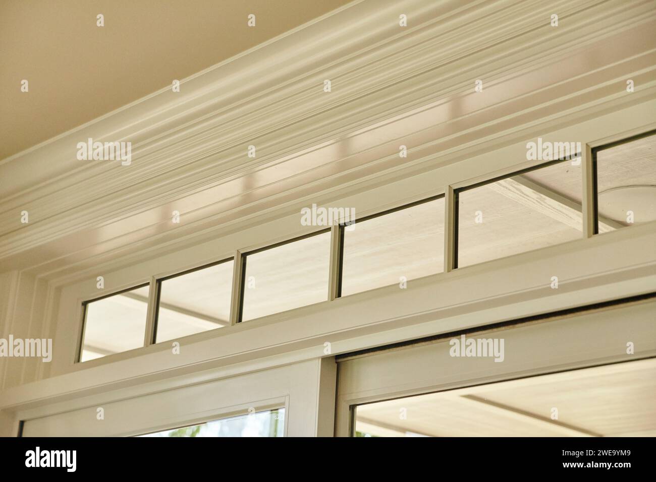 Elegant Crown Molding and Transom Windows Interior Detail Stock Photo