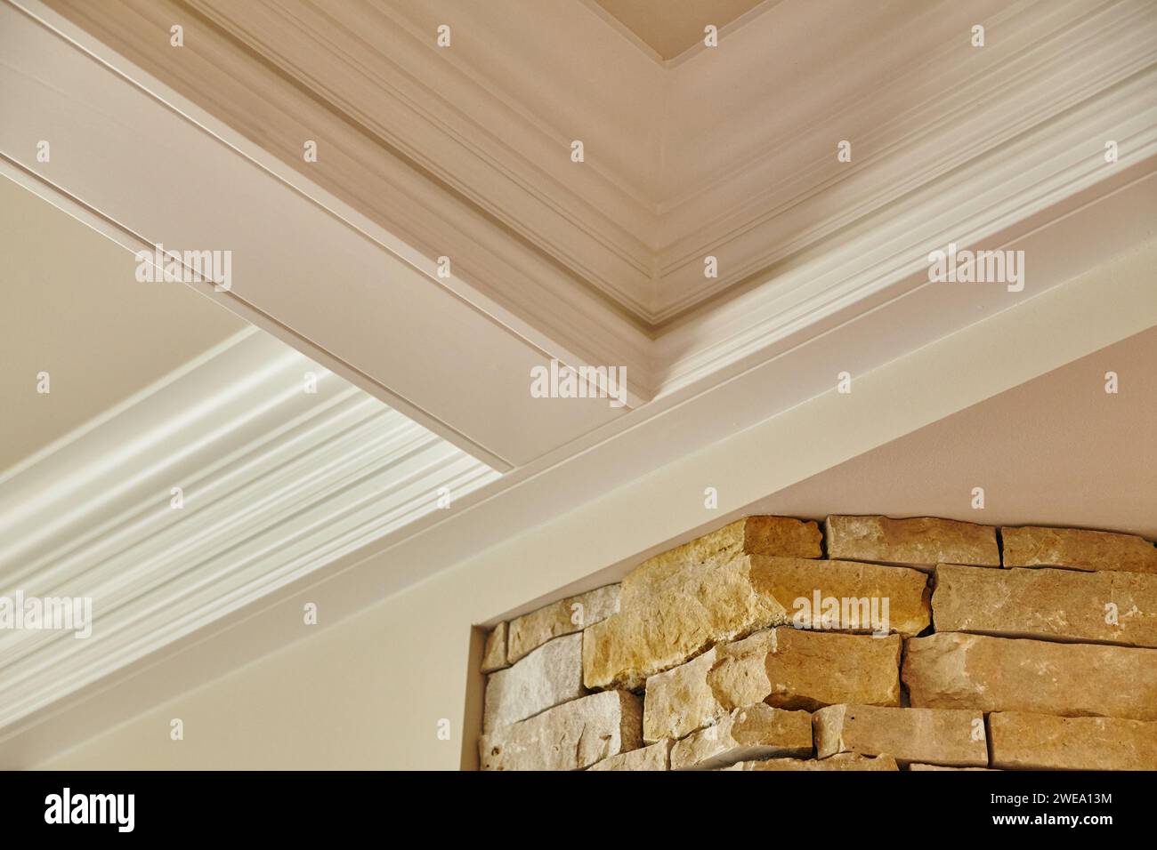 Curated visual reference: Visual Reference: Elegant Crown Molding And Stone Wall Detail Interior Design Stock