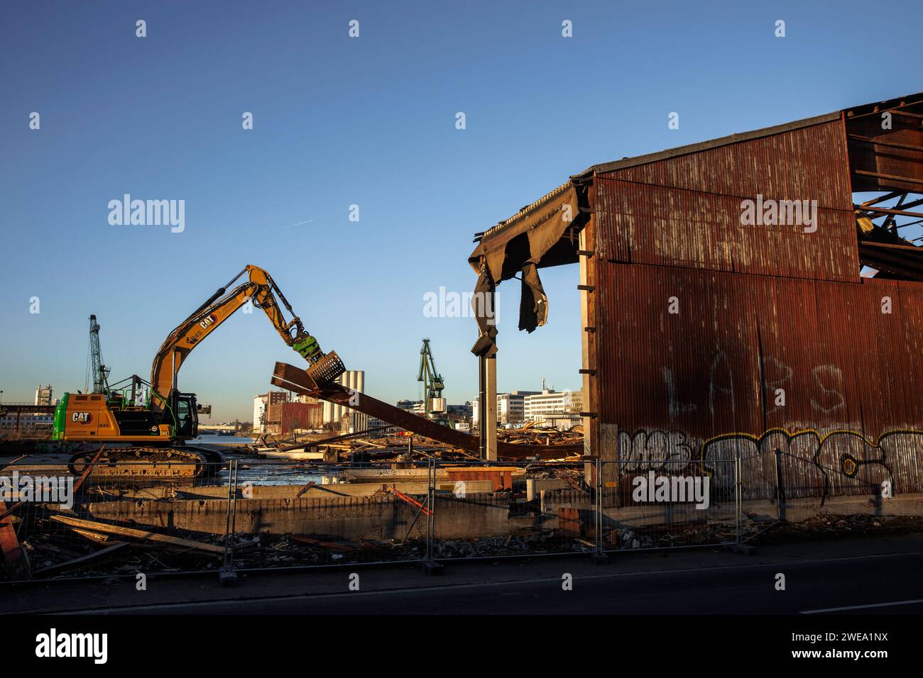 demolition of an old wooden warehouse building of the Thies company in the Rhine harbor in the district Deutz, a new urban quarter will be built here Stock Photo