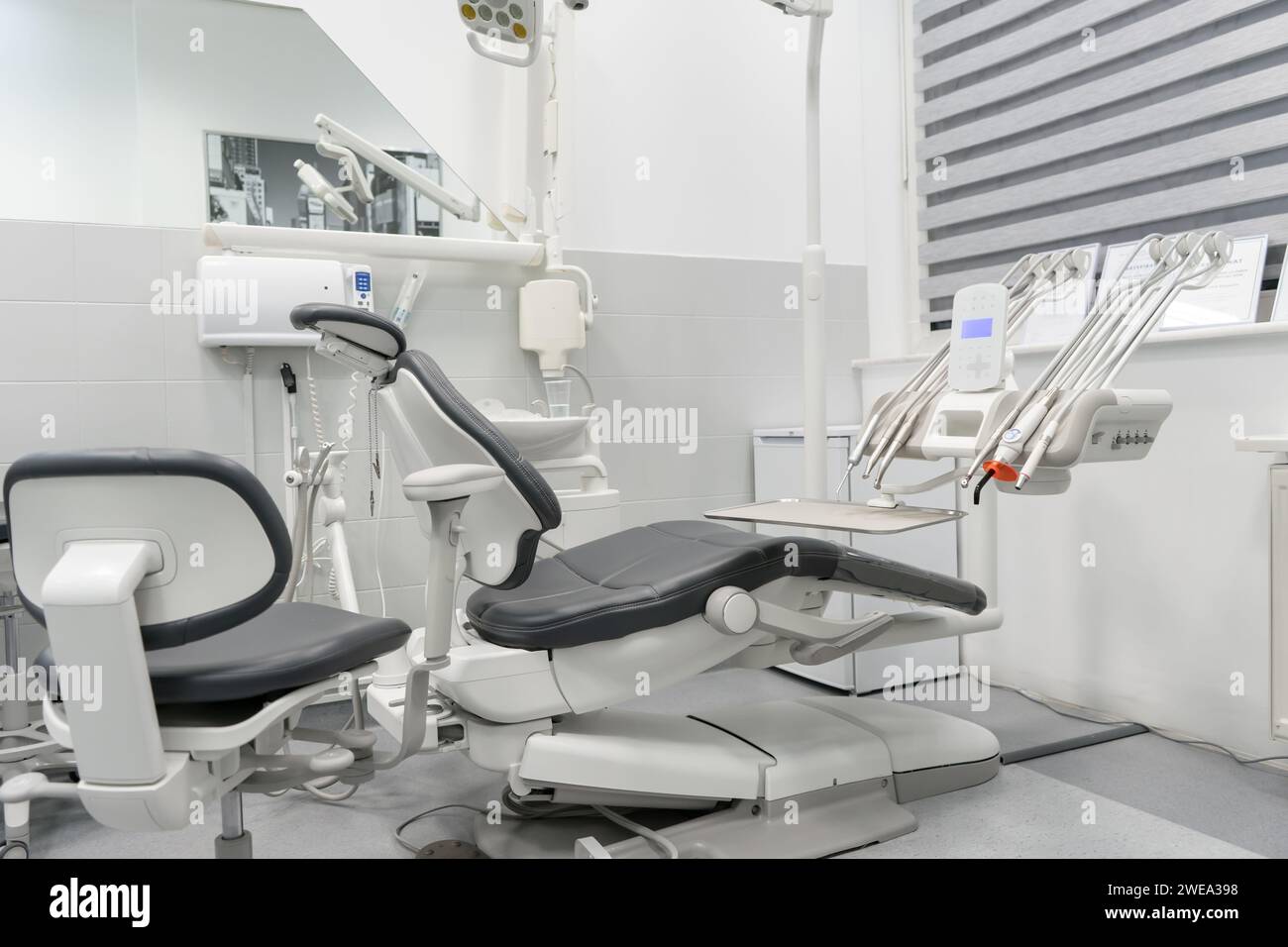 Dental integrated treatment machine in the dentist's office of the dental clinic. Dental equipment for the treatment of patients. Stock Photo
