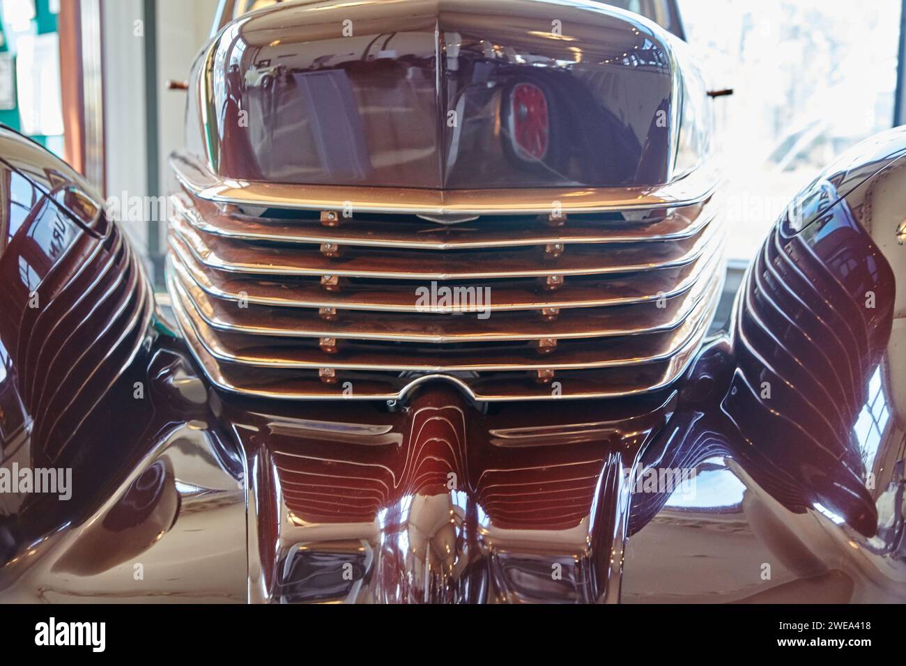 Classic Car Chrome Grille and Bumper Close-Up in Showroom Perspective Stock Photo