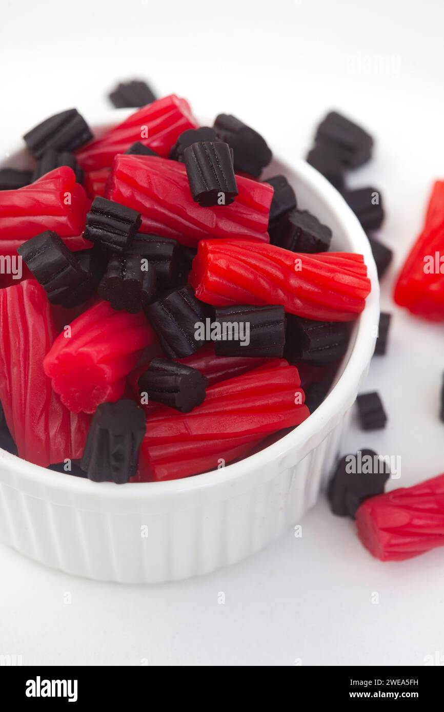 Bowl of mixed red and black licorice, top view with copy space Stock Photo