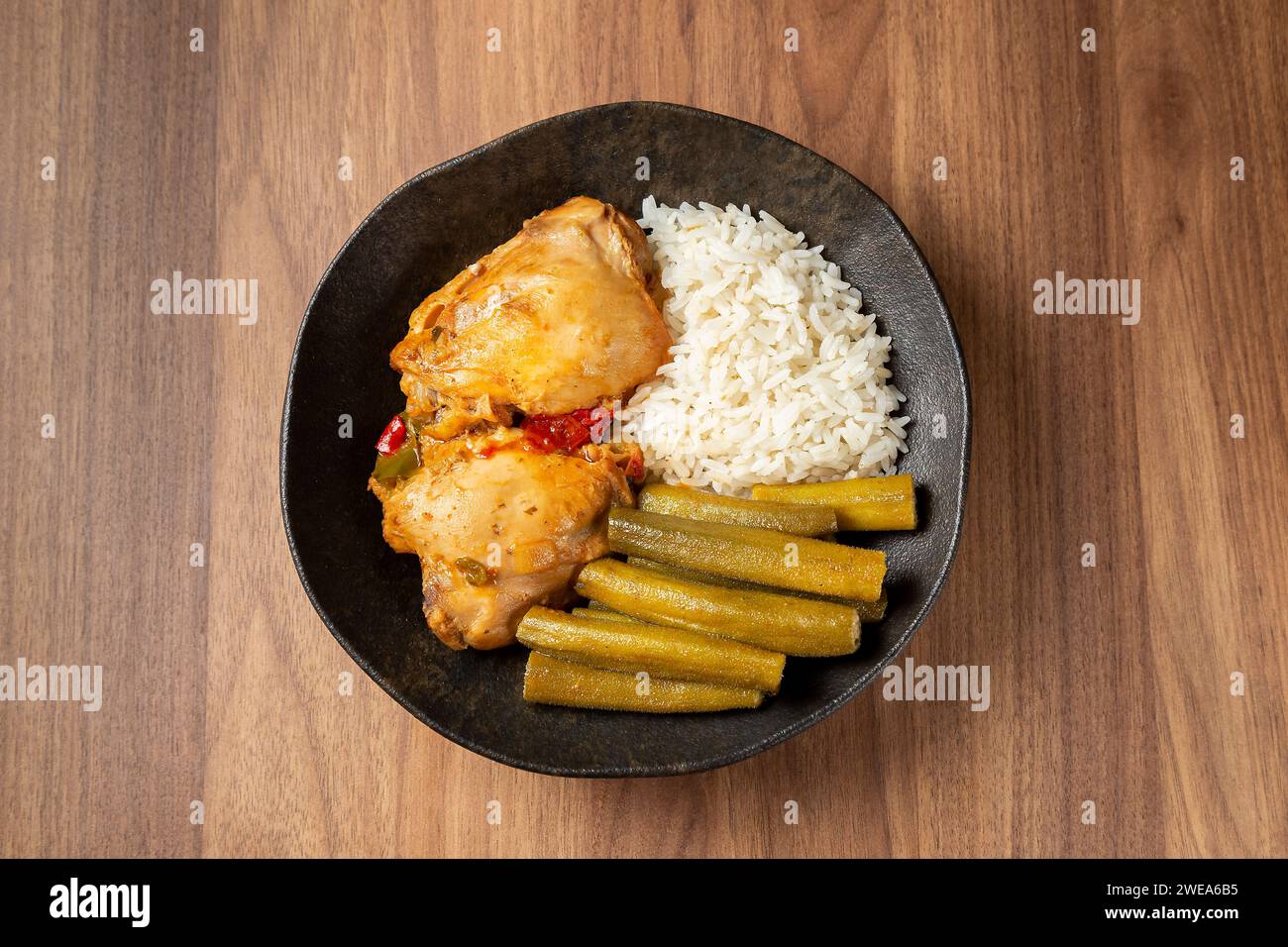 Chicken with okra and rice. Typical Brazilian dish. Stock Photo