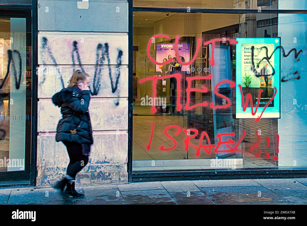 Glasgow, Scotland, UK. 24th January, 2024. Barclay's genocide graffiti as anti israel slogans are painted on the banks fascia on argyle street in the city centre. Credit Gerard Ferry/Alamy Live News Stock Photo