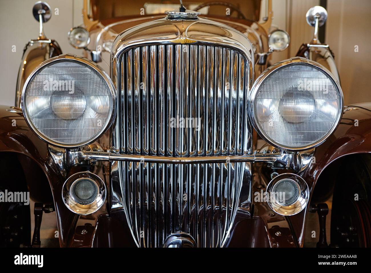 Vintage Car Chrome Grille and Emblem Close-Up Stock Photo