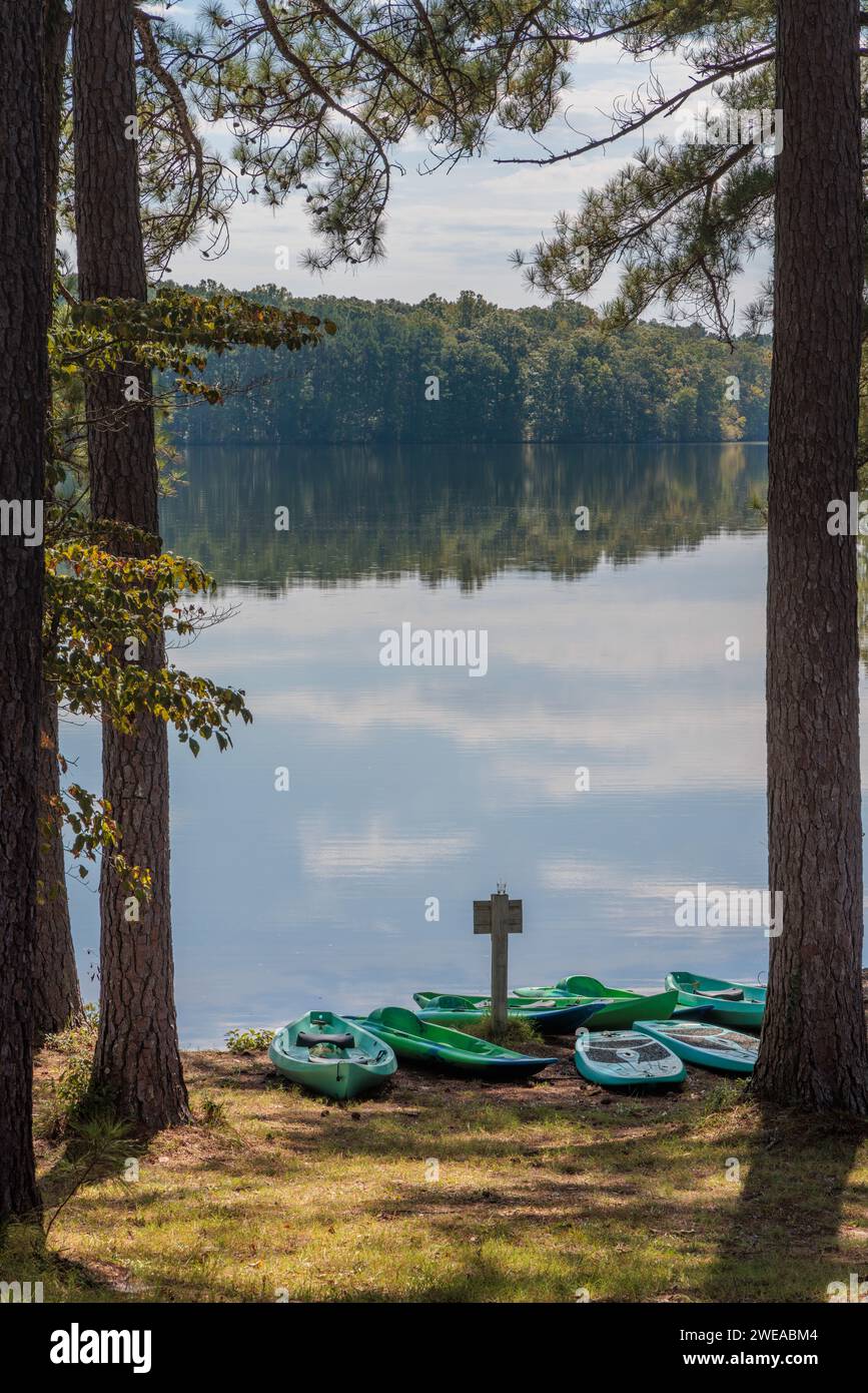 Plastic rental kayaks, canoes and paddleboards on the shore of Pin Oak Lake at The Lodge hotel in Natchez Trace State Park near Wildersville, Tennesse Stock Photo