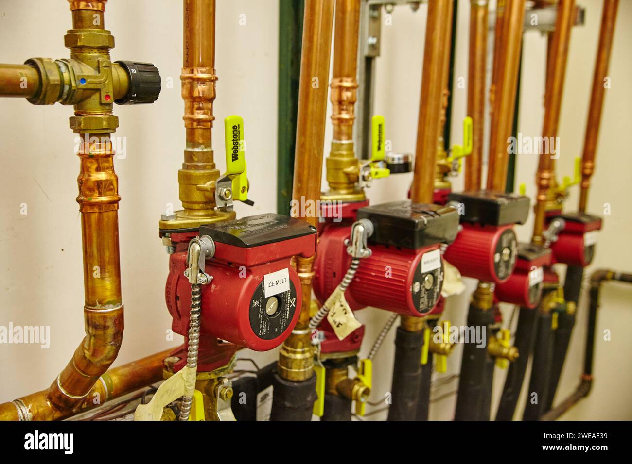 Industrial Pumps and Copper Piping in Mechanical Room Stock Photo - Alamy