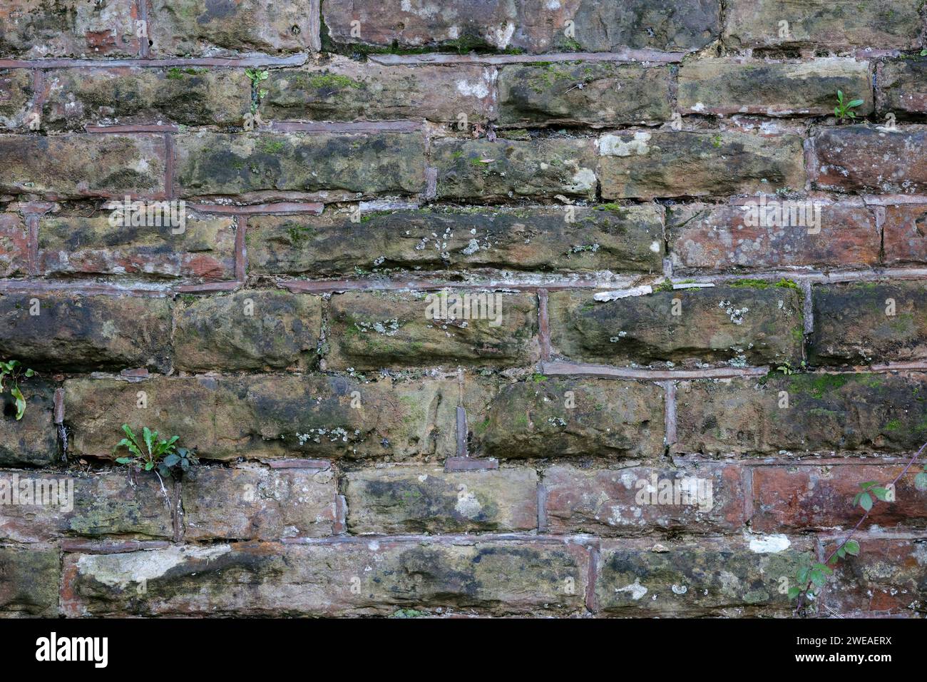 Brick wall railway bridge Horsham old worn weathered texture and shapes ideal for composite image background texture blending as added layer Stock Photo