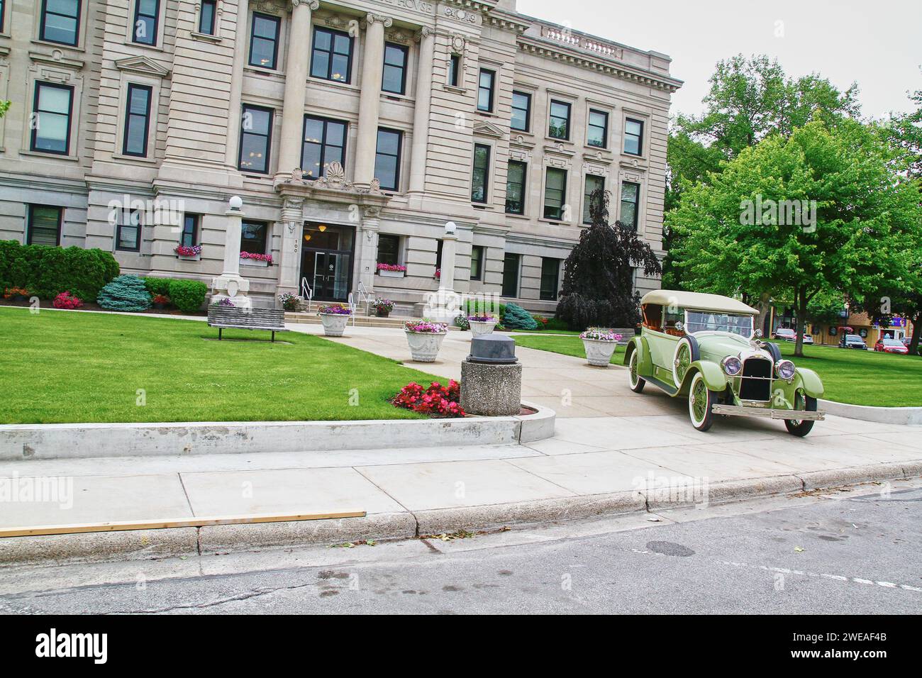 Vintage Car and Courthouse with American Flag Stock Photo