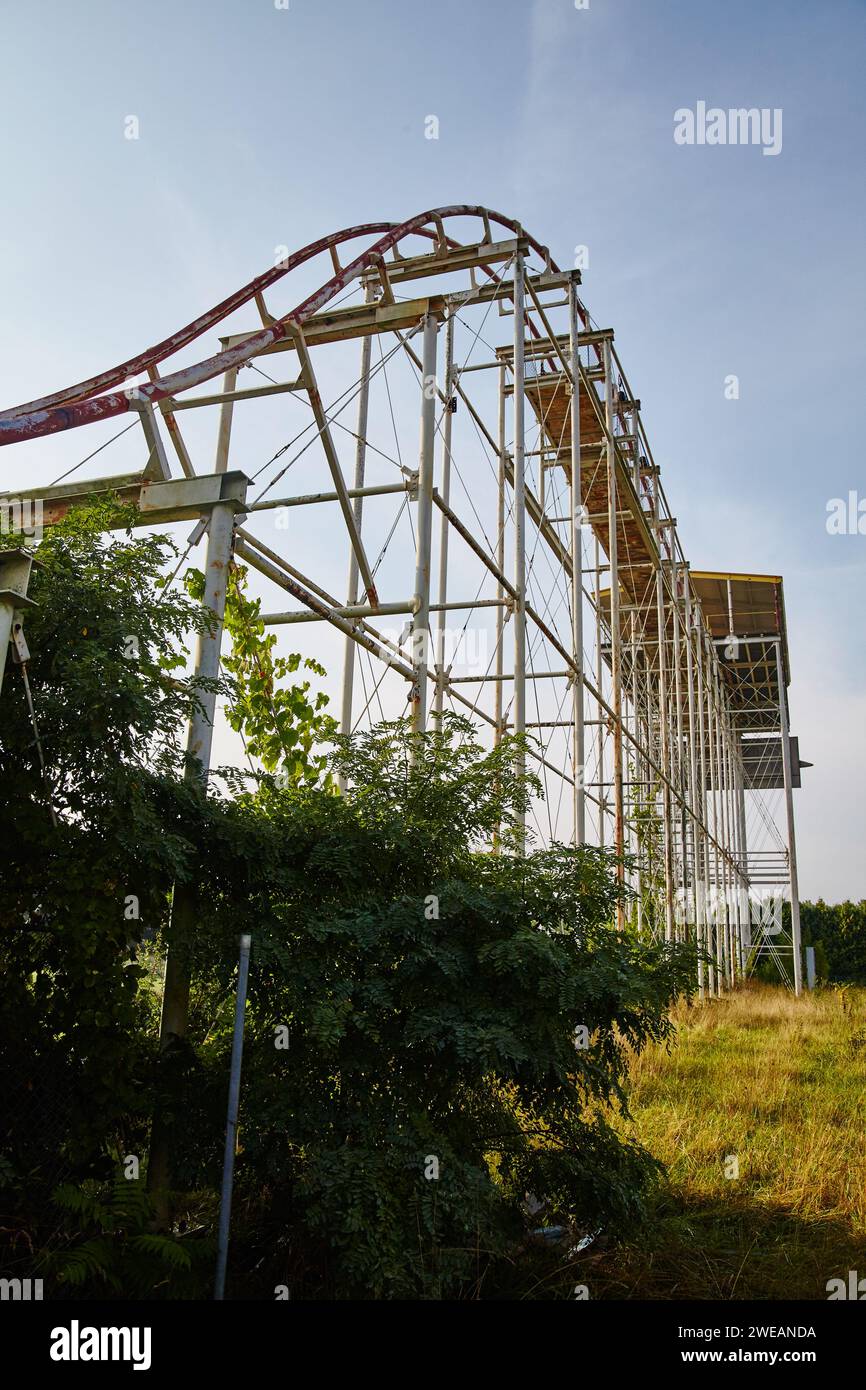 Abandoned Roller Coaster Amidst Overgrowth, Ground Up View Stock Photo