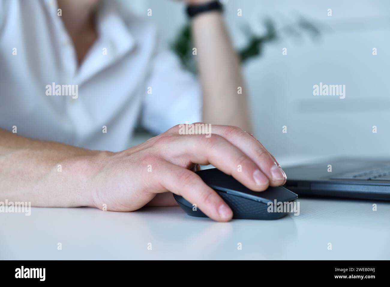 Hand businessman using computer mouse in office. Occupation and worker concept. Close up Stock Photo