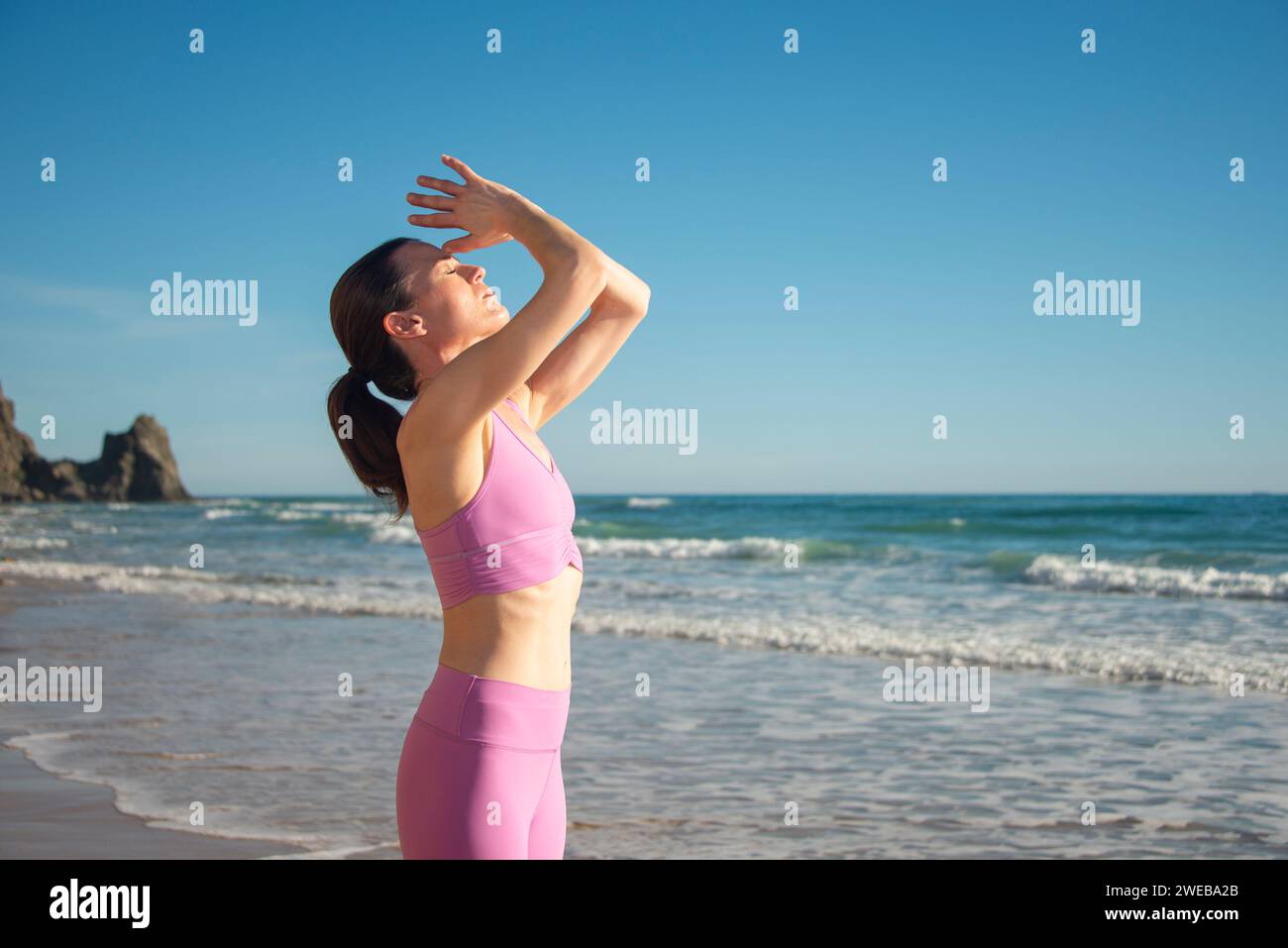 Woman yoga arms above head hi-res stock photography and images - Alamy