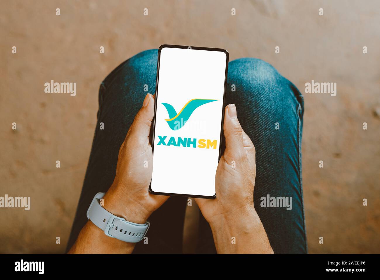 In this photo illustration, the Xanh SM (Green and Smart Mobility – GSM) logo is displayed on a smartphone screen. Stock Photo