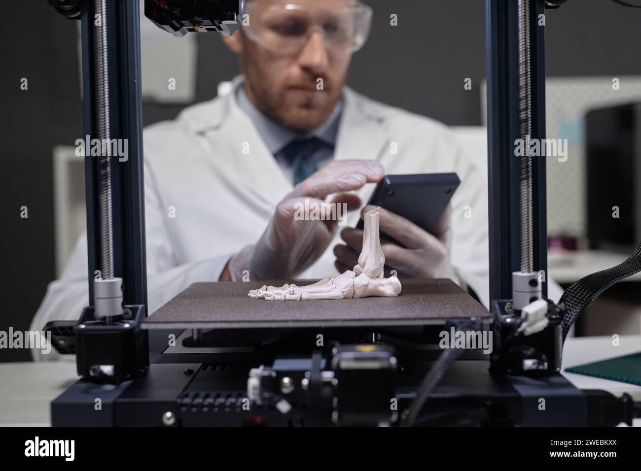Technician Working on 3D Bone Prototype Stock Photo