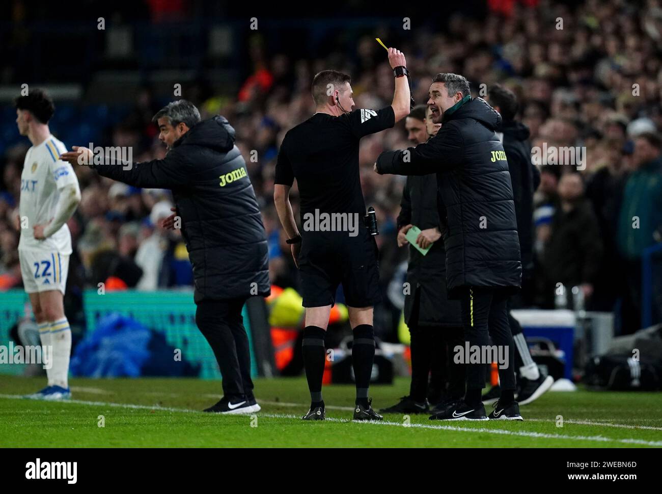 Norwich City coach Andrew Hughes is booked for dissent by referee Matt Donohue during the Sky Bet Championship match at Elland Road, Leeds. Picture date: Wednesday January 24, 2024. Stock Photo