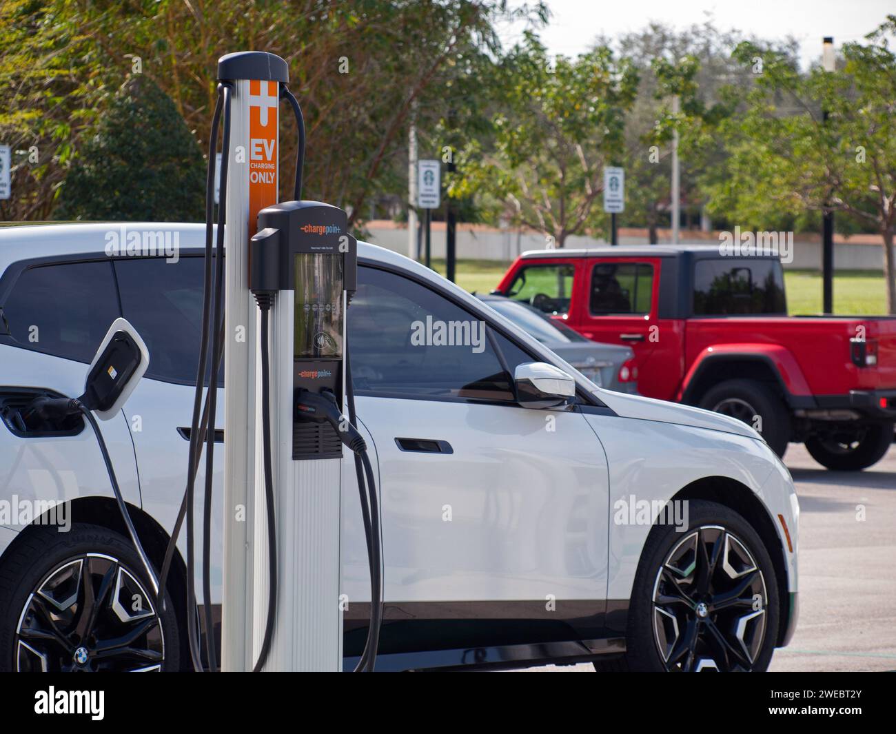 Miami, Florida, United States - November 28, 2023 - Vehicle using a ChargePoint EV charging stations. Stock Photo