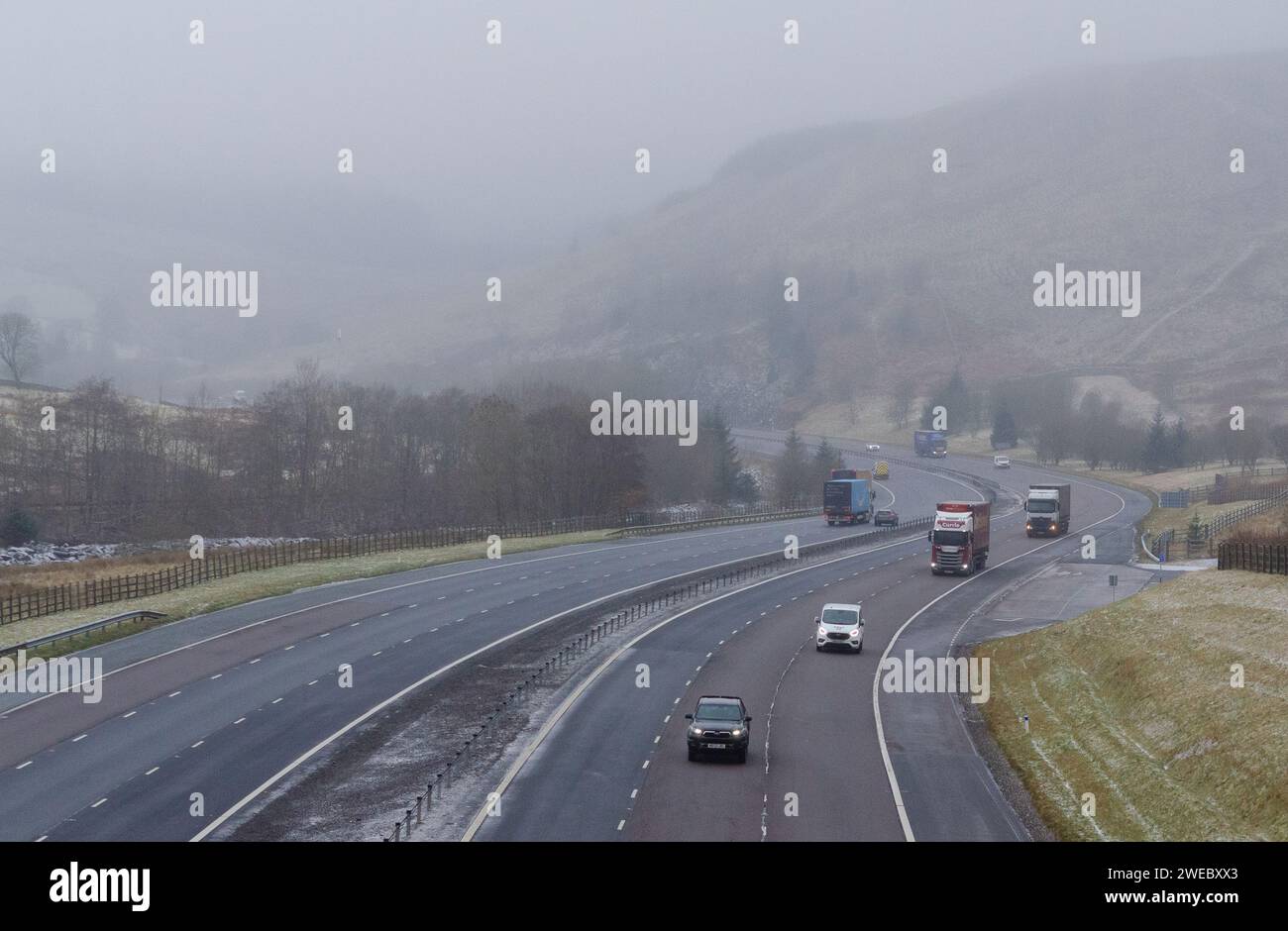 NEAR MOFFAT, SCOTLAND, UK - 16 January 2024 - Traffic on the M74 near Moffat today (Monday), as snow moves south pushed along by an arctic blast which Stock Photo