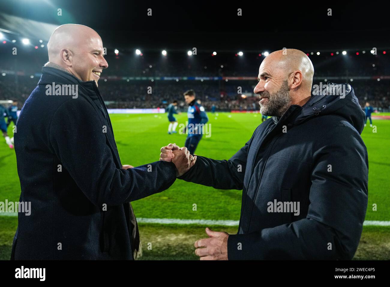 Rotterdam, Netherlands. 24th Jan, 2024. Rotterdam - Feyenoord coach Arne Slot, Peter Bosz of PSV during the match between Feyenoord v PSV at Stadion Feijenoord De Kuip on 24 January 2024 in Rotterdam, Netherlands. Credit: box to box pictures/Alamy Live News Stock Photo