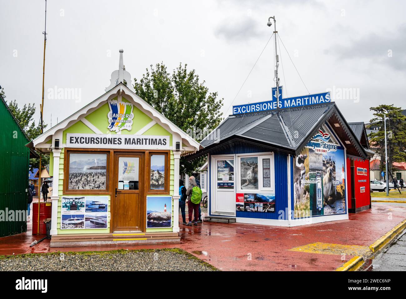 Small sheds along the street of Puerto Willams selling land excursions to to tourists and cruise ship passengers. Ushuaia, Argentina. Stock Photo