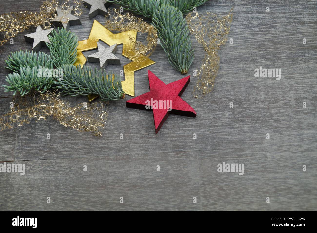 fir branches, decorative stars and angel hair Stock Photo