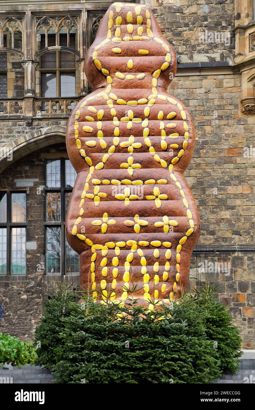 artificial gingerbread man in front of the town hall as a landmark at the Christmas market, Germany, North Rhine-Westphalia, Aix-la-Chapelle Stock Photo