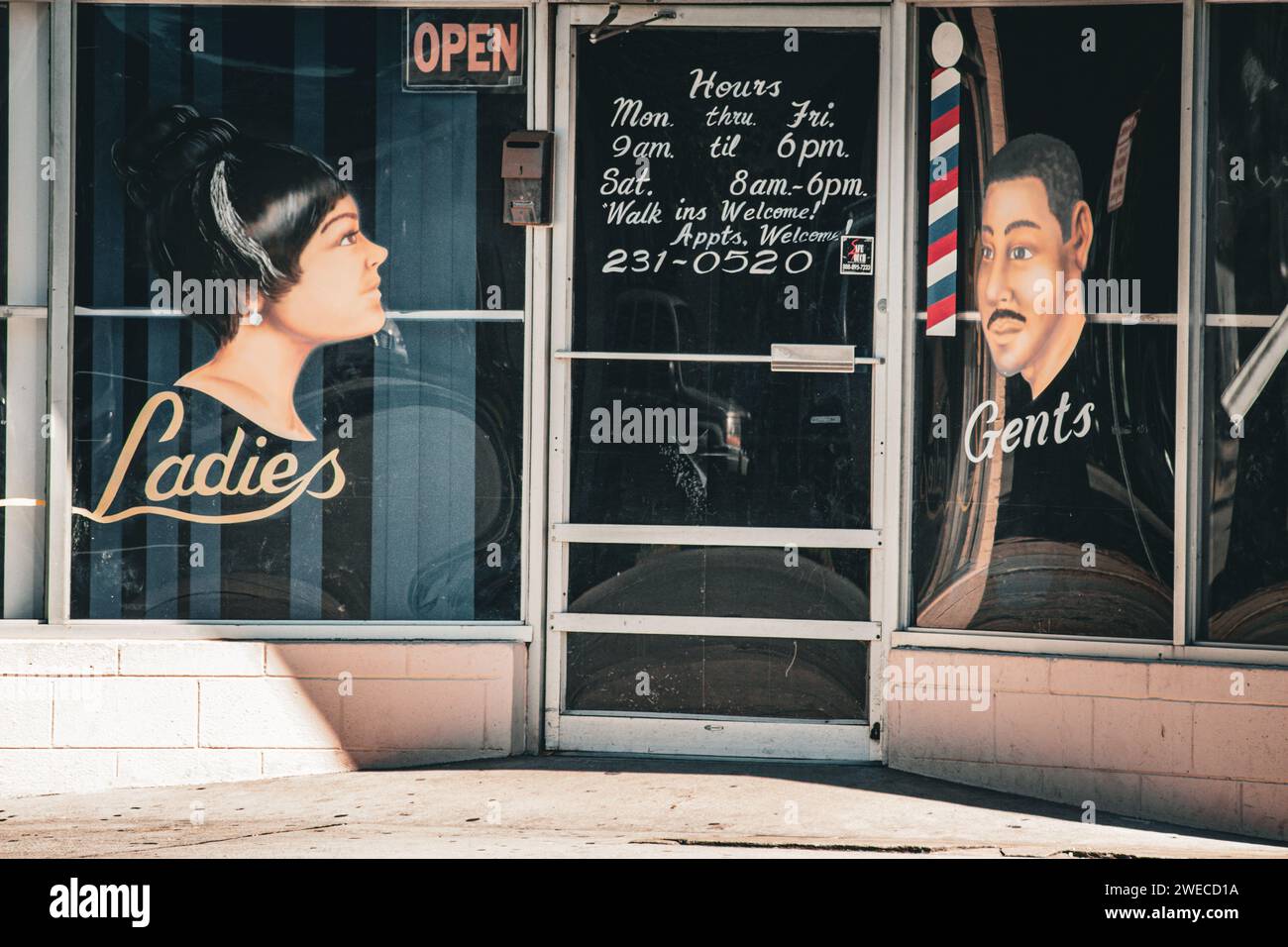 Facade of an African American Barbershop in Savannah Georgia with Hand Painted sign - First Class Beauty and Barber Black History Stock Photo