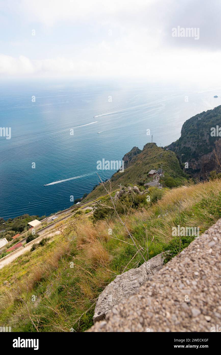 Photograph taken in a town near Sorrento, Italy, featuring a view of the lush green mountain, the sea, and the surrounding natural landscape Stock Photo