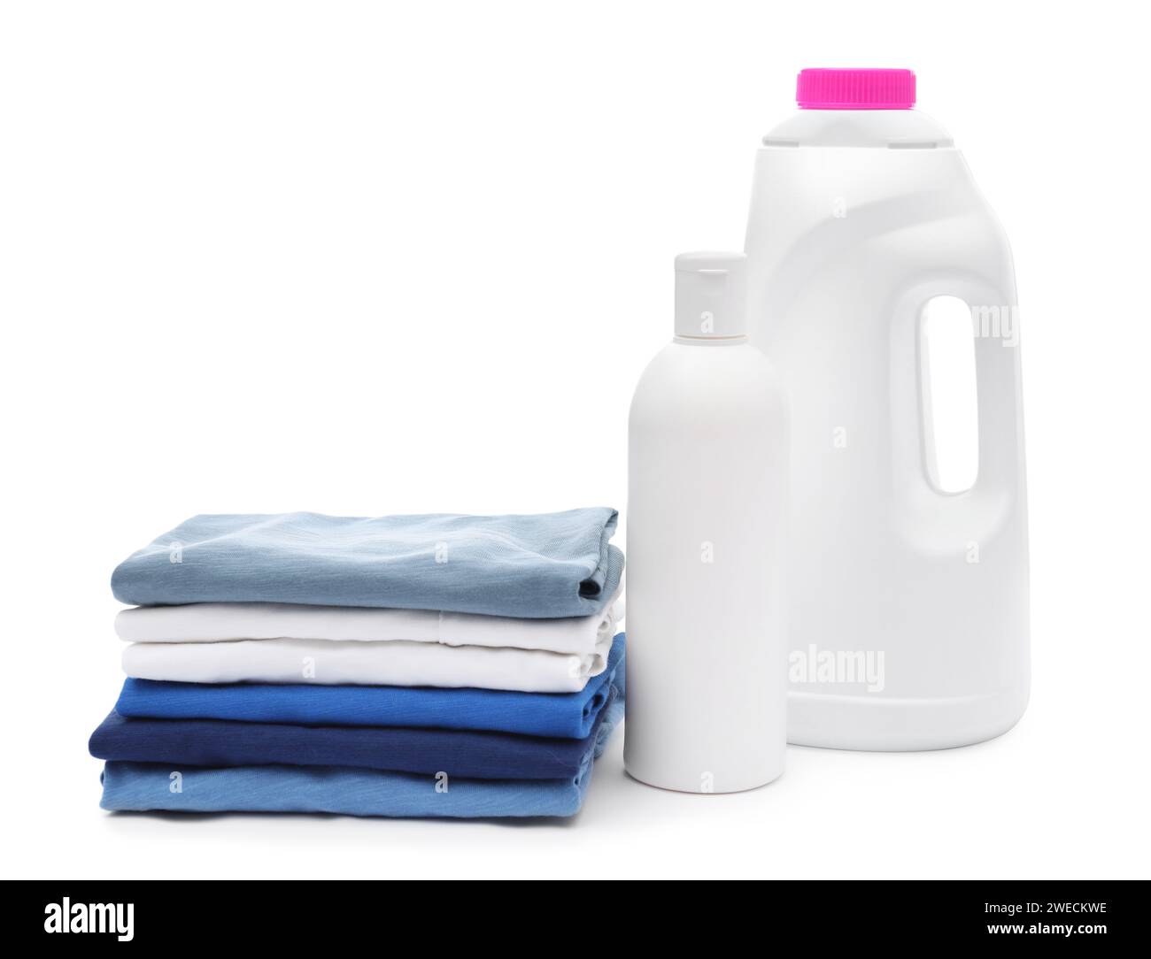 Stack of baby clothes and laundry detergents isolated on white Stock