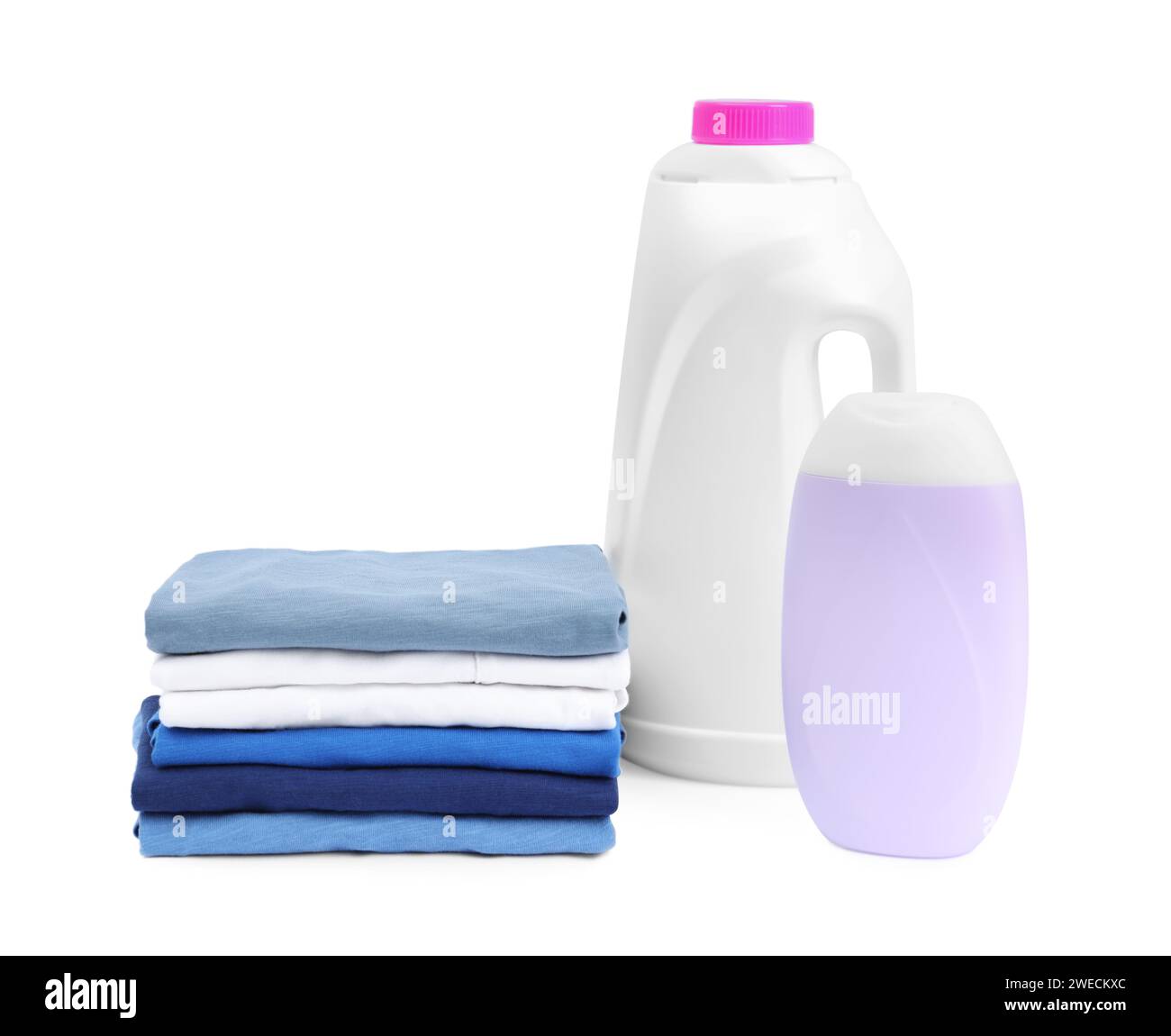 Stack of baby clothes and laundry detergents isolated on white Stock