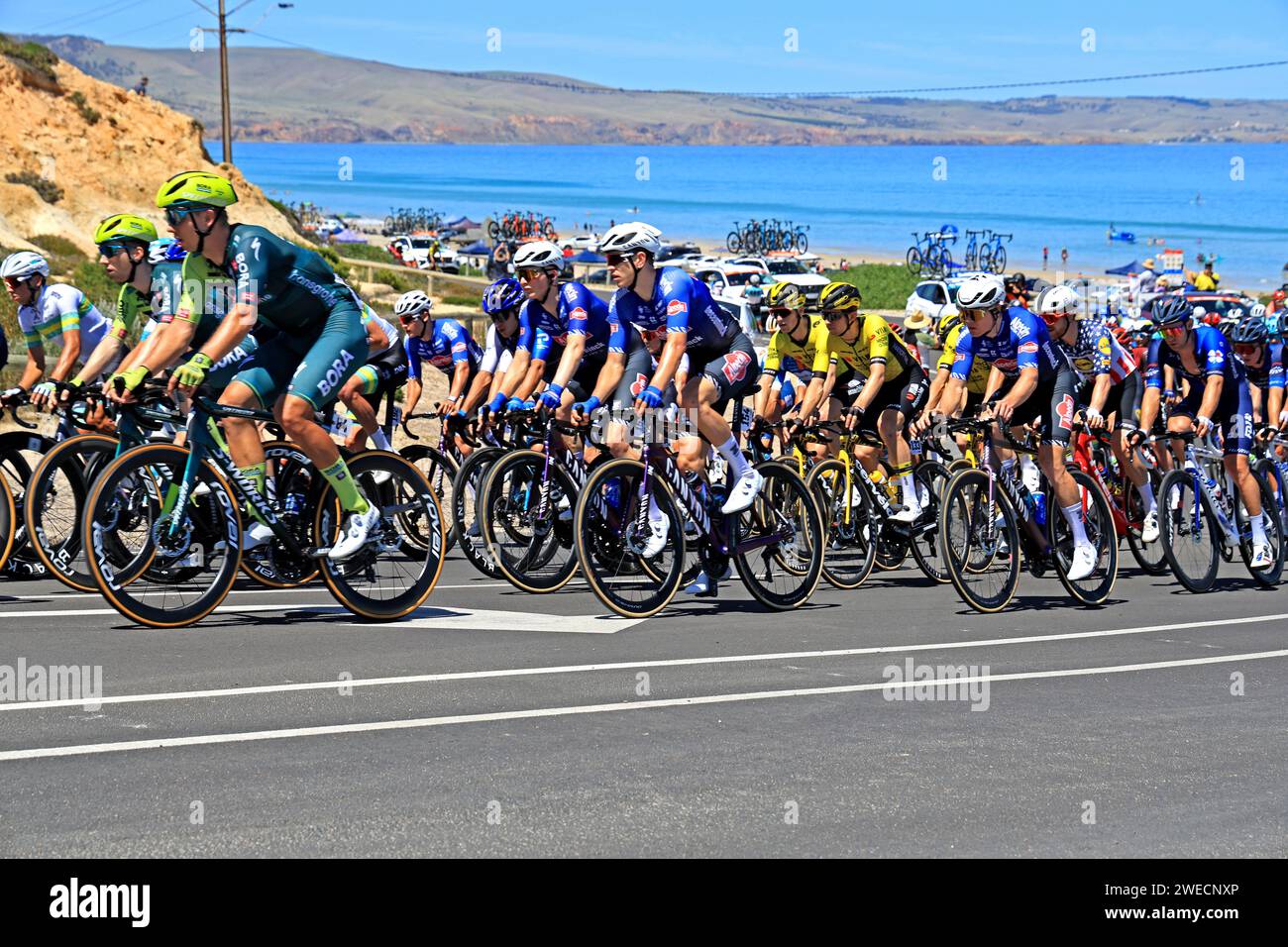 Riders competing during stage 5 of the 2024 Tour Down Under at Aldinga