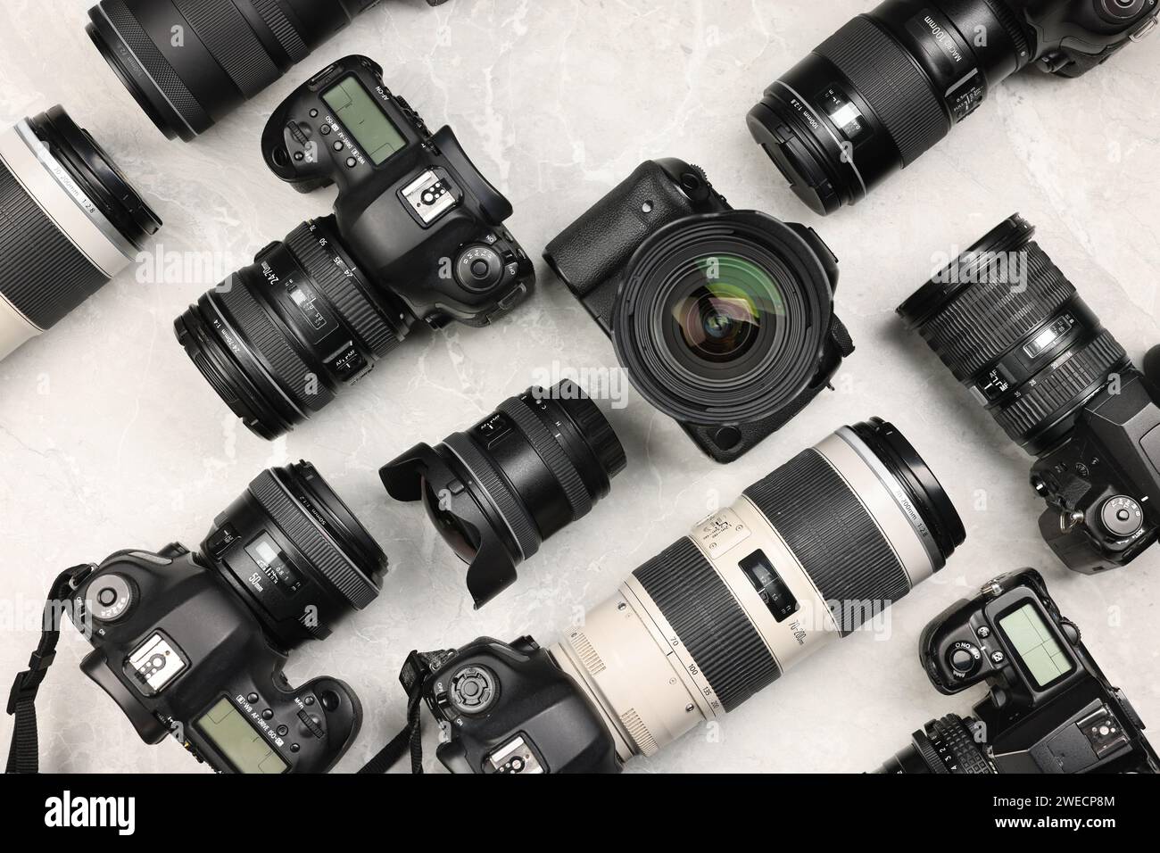 Modern cameras on gray marble table, flat lay Stock Photo - Alamy