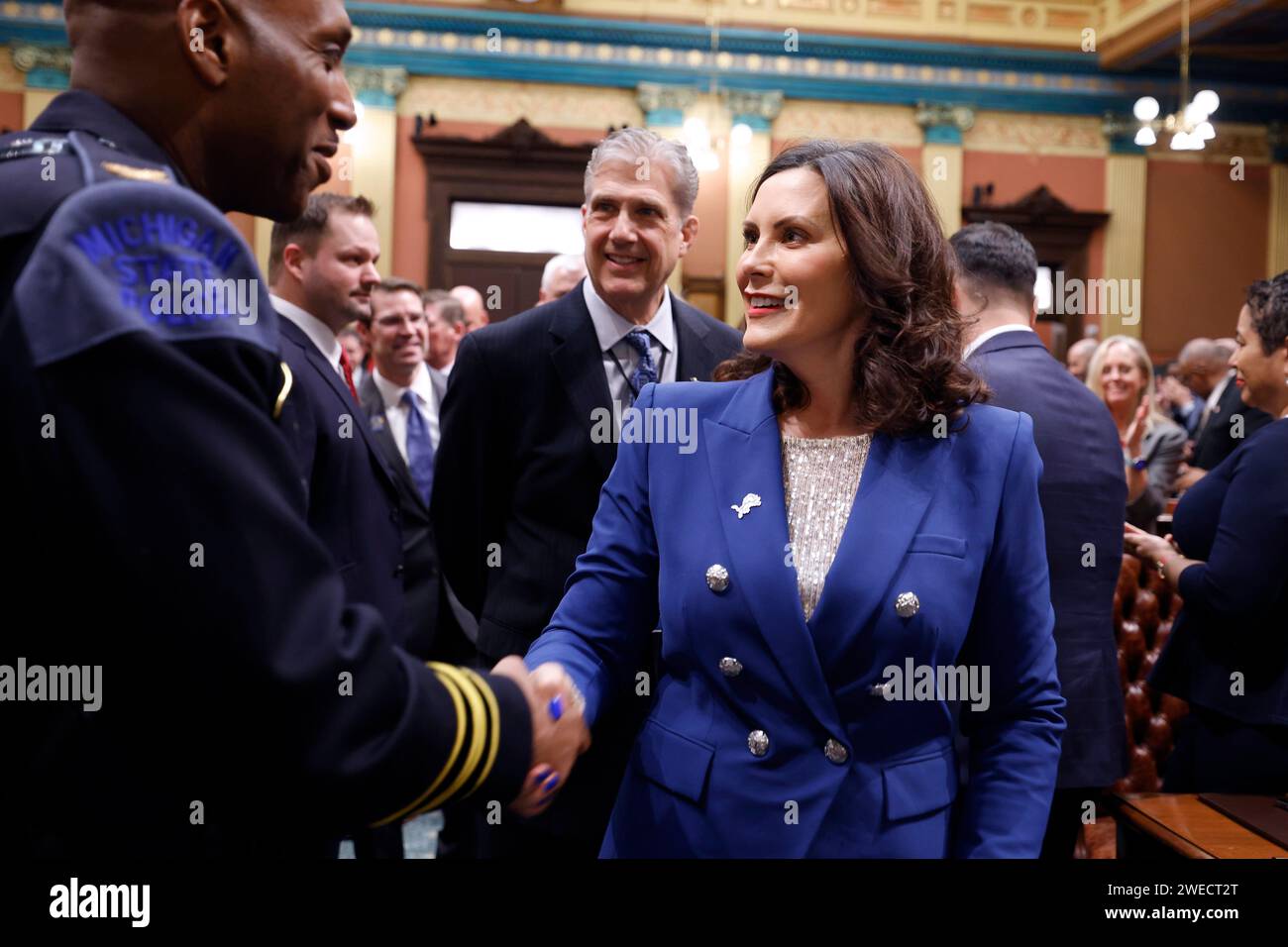 Michigan Gov. Gretchen Whitmer, right, greets Michigan State Police