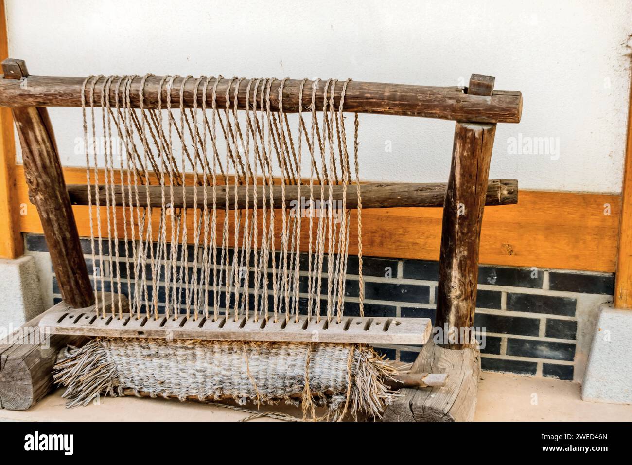 Old fashioned Korean hand loom used to make traditional straw beds in