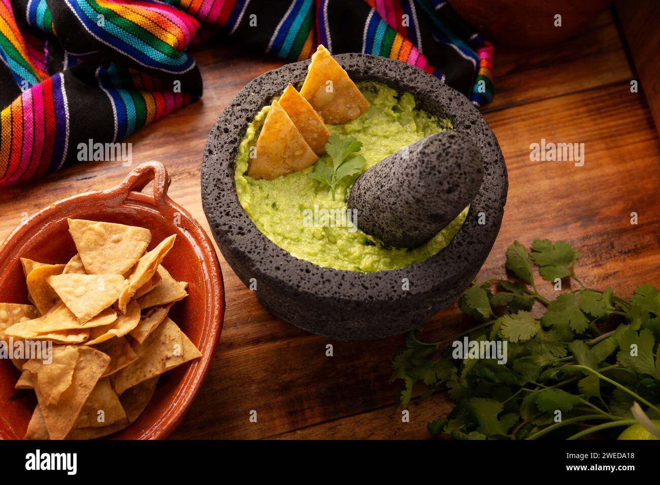 Guacamole. Avocado dip with tortilla chips also called Nachos served in
