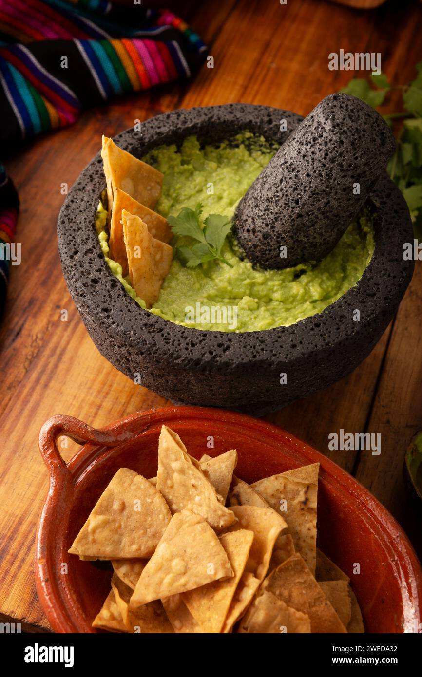 Guacamole. Avocado dip with tortilla chips also called Nachos served in ...