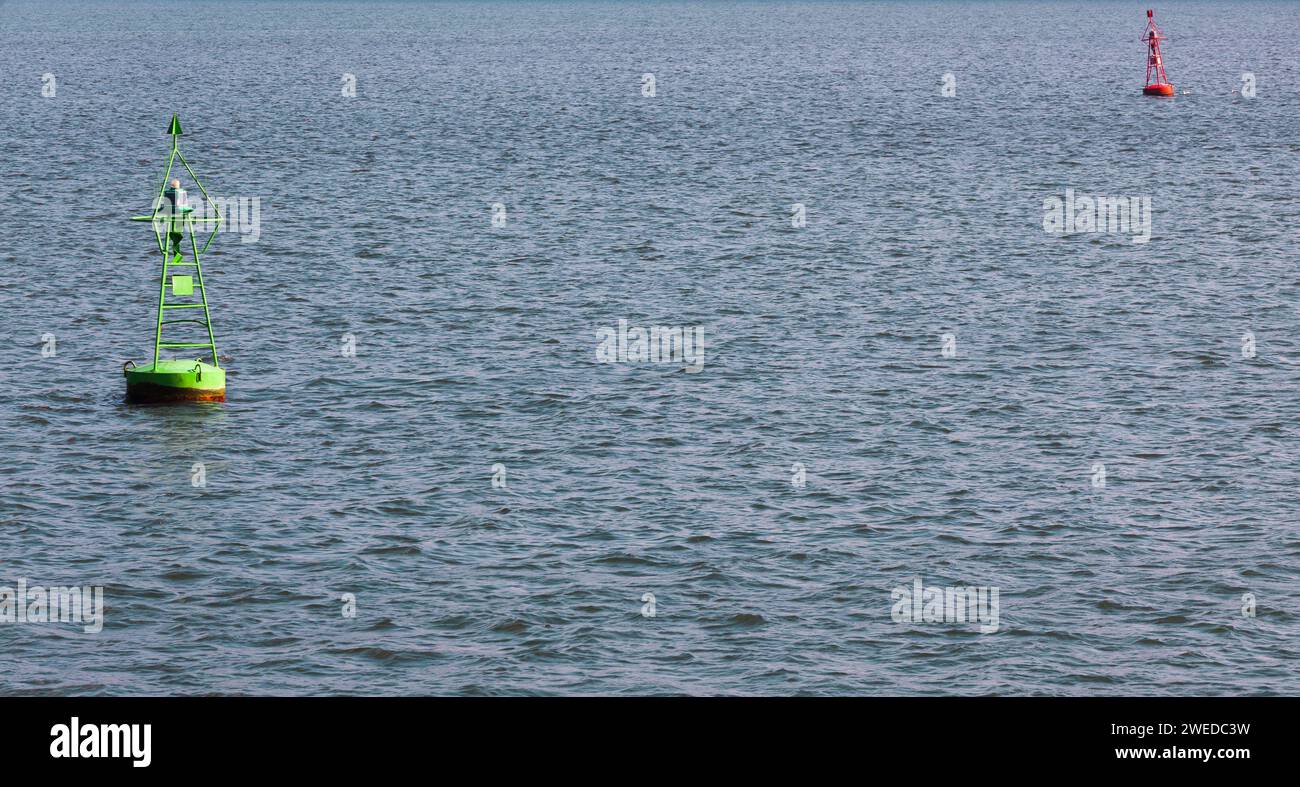 Green and red buoys marking the boundaries of the fairway Stock Photo