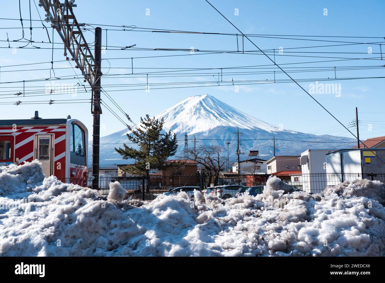 Mount Fuji and a pile of snow near Kawaguchiko Station Stock Photo