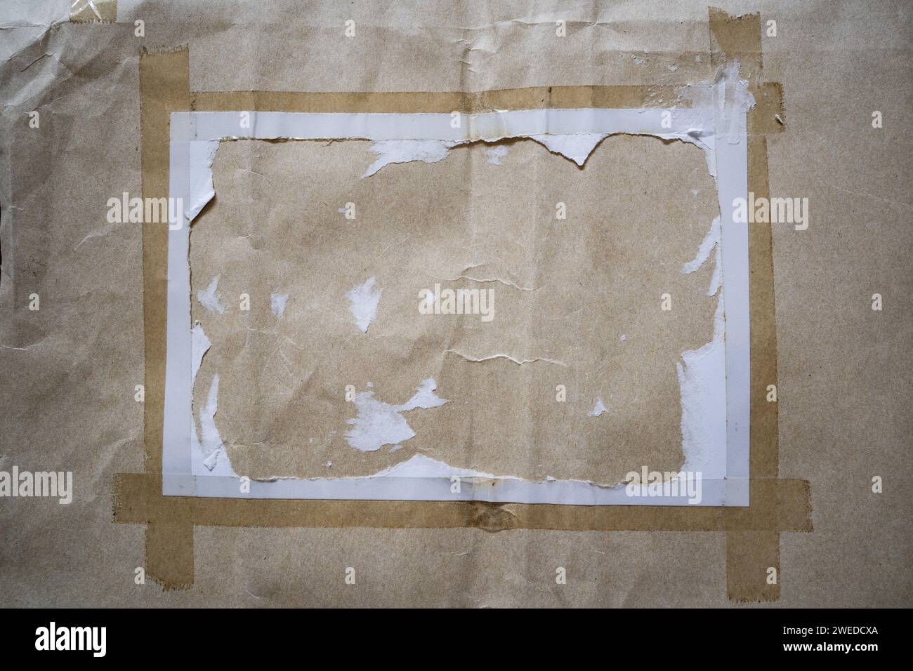 Peeled white paper on kraft paper envelope texture background Stock Photo